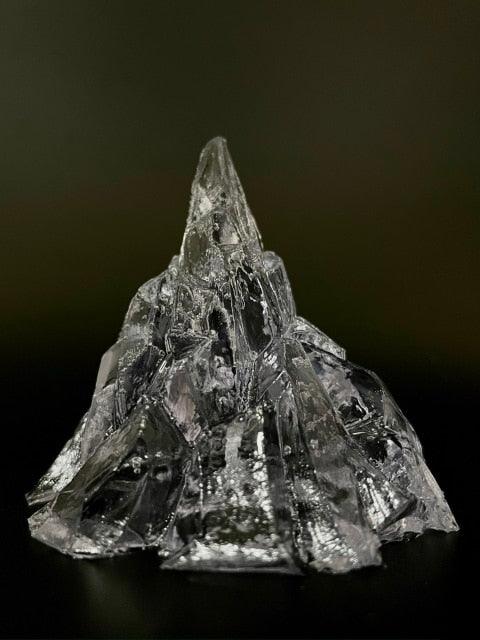 Elegant, romantic, handmade transparent 3D floating iceberg made of jelly wax, clear wick.
