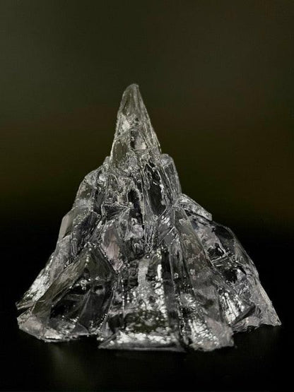 Elegant, romantic, handmade transparent 3D floating iceberg made of jelly wax, clear wick.