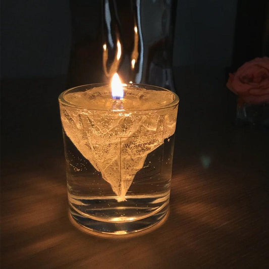 Elegant, romantic, handmade transparent 3D floating iceberg made of jelly wax, clear wick.