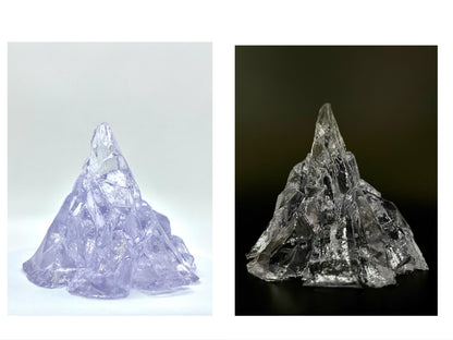 Elegant, romantic, handmade transparent 3D floating iceberg made of jelly wax, clear wick.