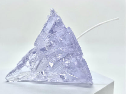 Elegant, romantic, handmade transparent 3D floating iceberg made of jelly wax, clear wick.